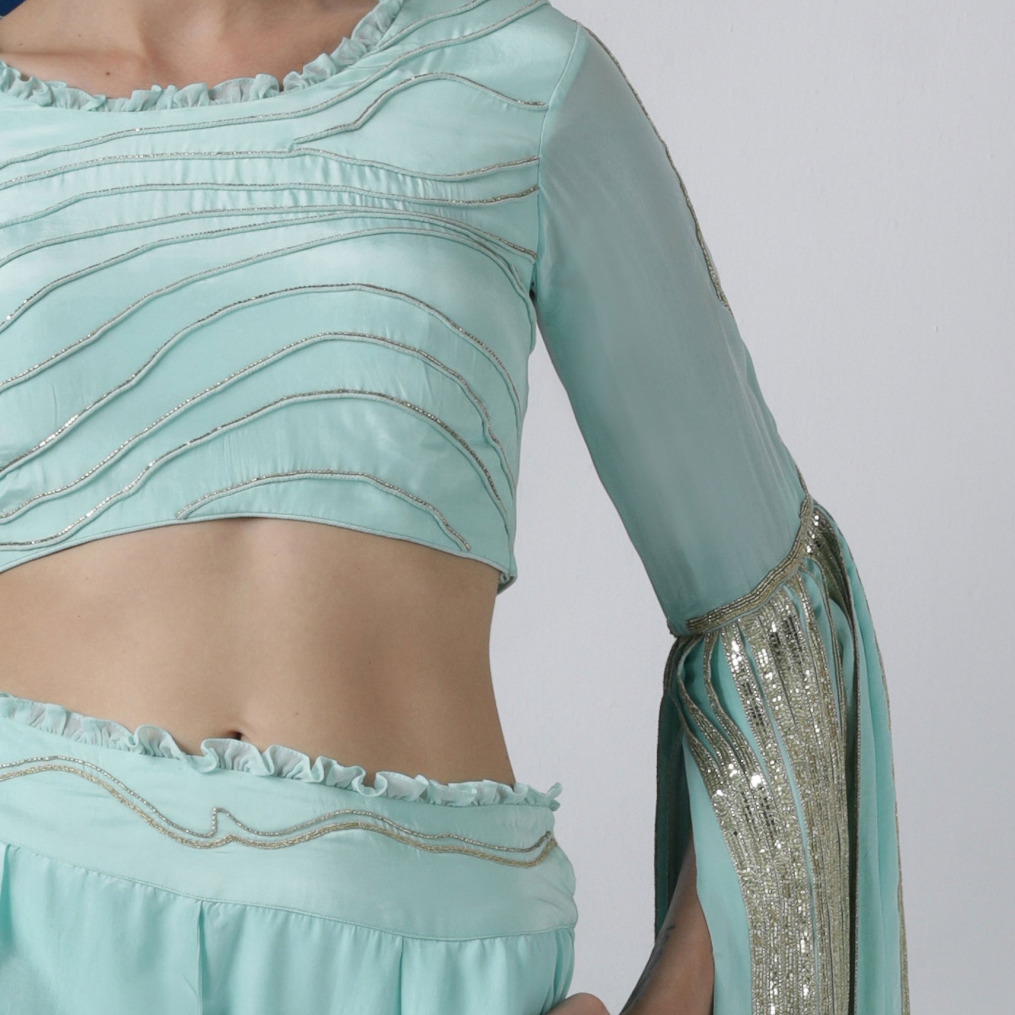 Embroidered Blouse with Exaggerated Sleeves Paired with Wide Legged Pants
